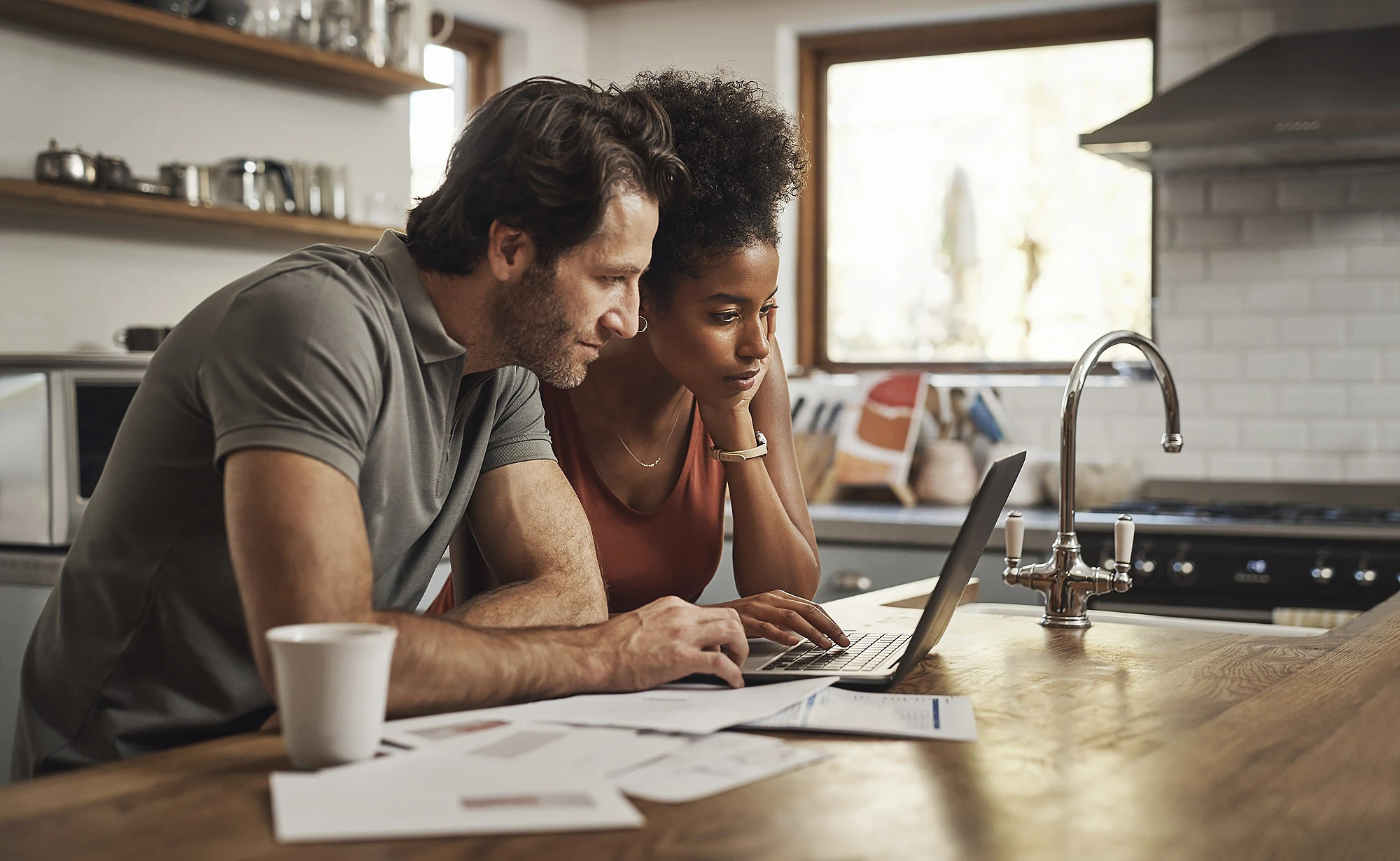 Employee Benefits A pair fist-pumping in an office
